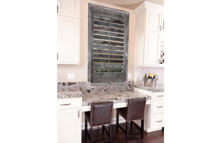 Kitchen window with reclaimed wood shutters in St. George